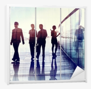 Silhouettes Of Business People Walking In The Office