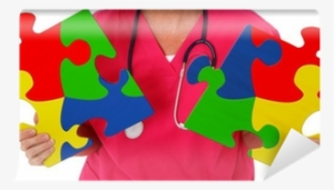 Nurse Holding Two Puzzle Pieces Representing Autism - Katherine Goodsell Psychological Services