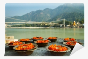 Puja Flowers Offering At The Bank Of Ganges River In