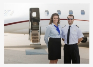 Airhostess And Pilot Standing Against Private Jet Poster - Privé Stuwardess