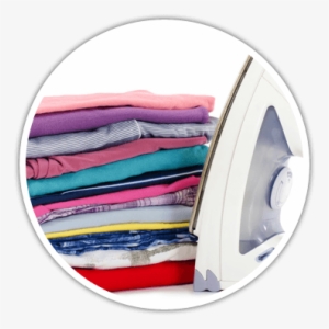 A White Iron Next To A Pile Of Folded Clothes - Одежда После Стирки