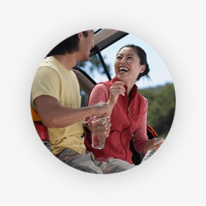Man And Woman Laughing And Leaning Against Their Suv - Quest Diagnostics Publicidad