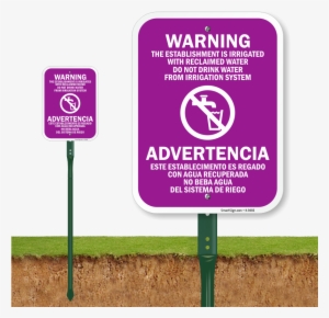 Bilingual Establishment Irrigated With Reclaimed Water - Do Not Feed The Pigeons Sign