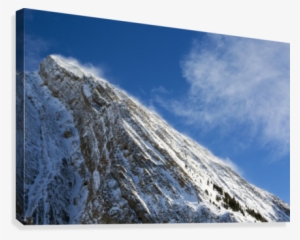 Close Up Of A Snow Covered Mountain Peak With Wind