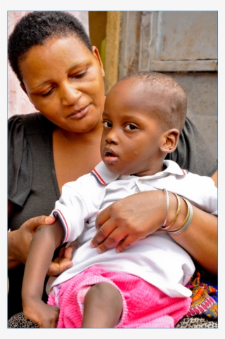Disabled Child In A Wheelchair - Father