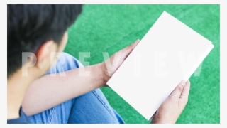 Book Mockup Template Of A Young Man Holding A Nove - Girl