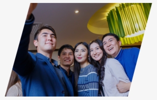 A Group Of International Students Taking A Selfie