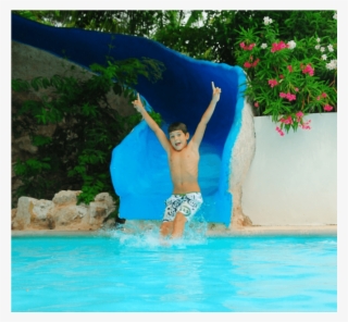 Child With Juice On Small Bed In Pool Area At Kiddozone