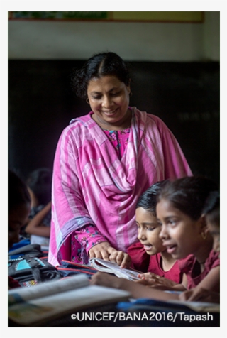 A Primary School Teacher Engaging With Her Students - Girl