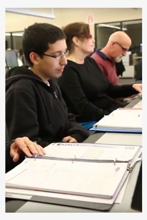 Three Students Seated Togther In Classroom With Notes - Student