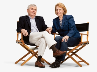 Happy Elderly Couple Sitting In Directors Chairs - Sitting